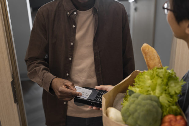 man-paying-groceries-front-view-618x412.jpg