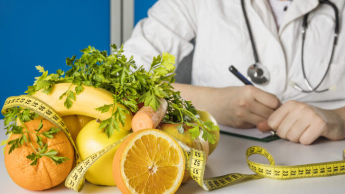 fresh-healthy-fruits-with-measuring-tape-dietician-s-desk-733x412.jpg